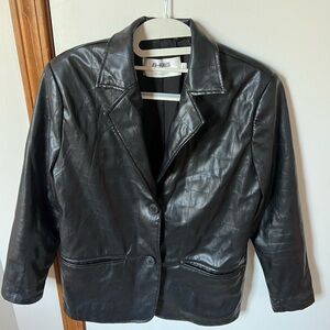 Oversized black leather jacket.